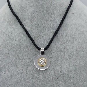 Cookie Lee cord necklace‎ with silver and gold rhinestone pendant